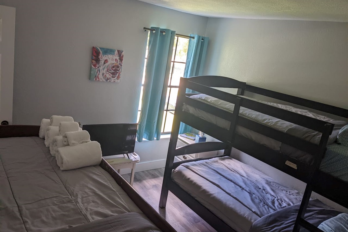Kids room - 2 sets of bunk beds, TV, and games