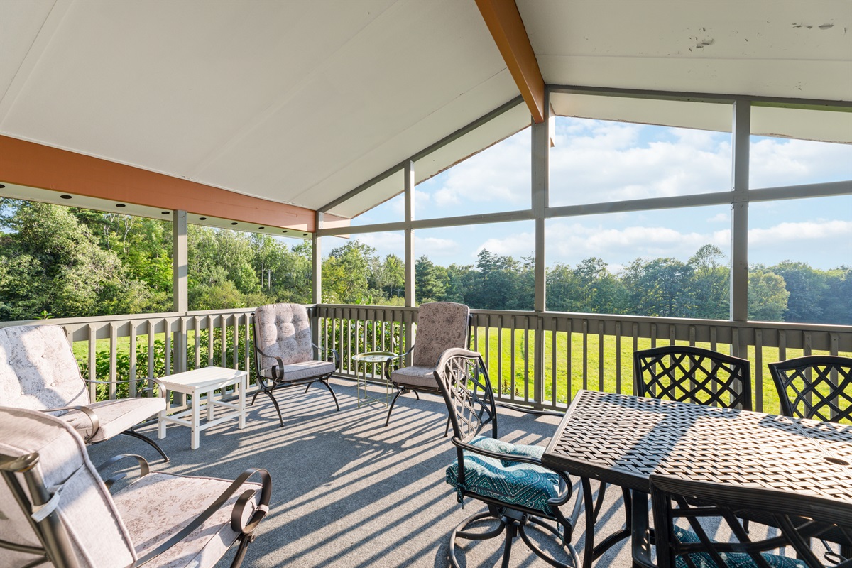 Covered Deck/Porch off upstairs livingroom overlooking field