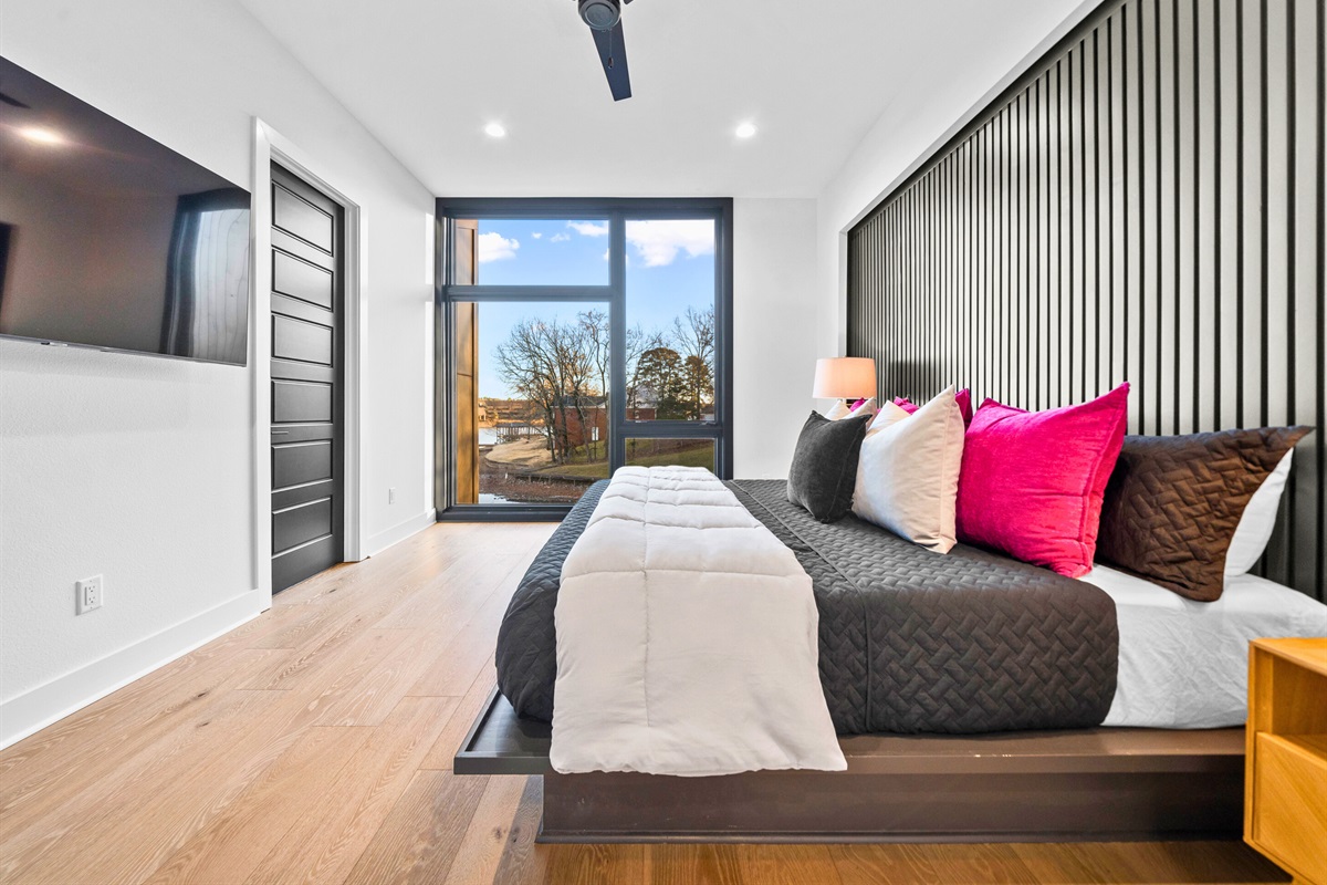 This king bedroom strikes the perfect balance of style and comfort, featuring modern furnishings, plush bedding, and vibrant decor.