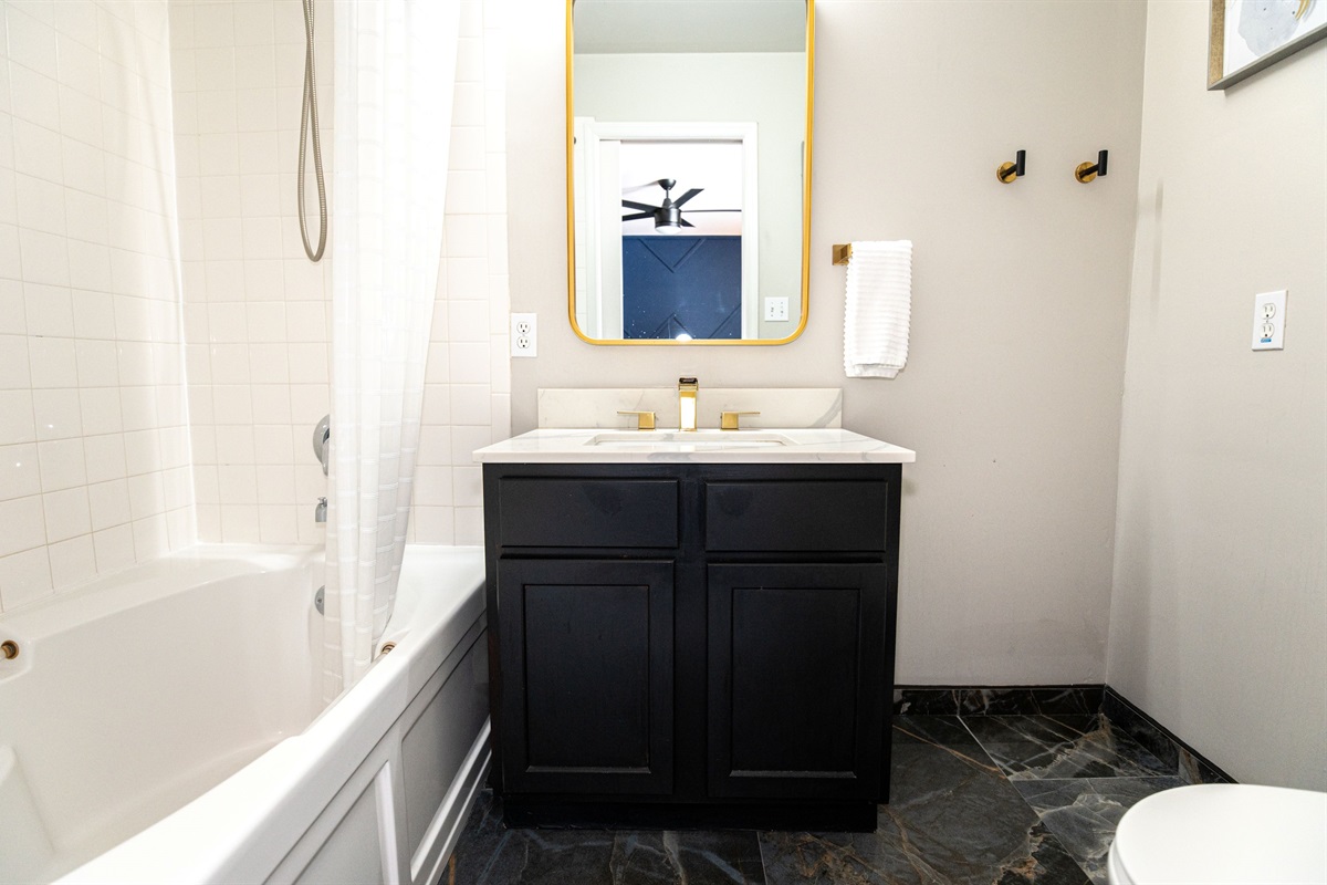 Attached to the upstairs king suite, this private full bath offers comfort, convenience, and a clean, calming space to unwind.