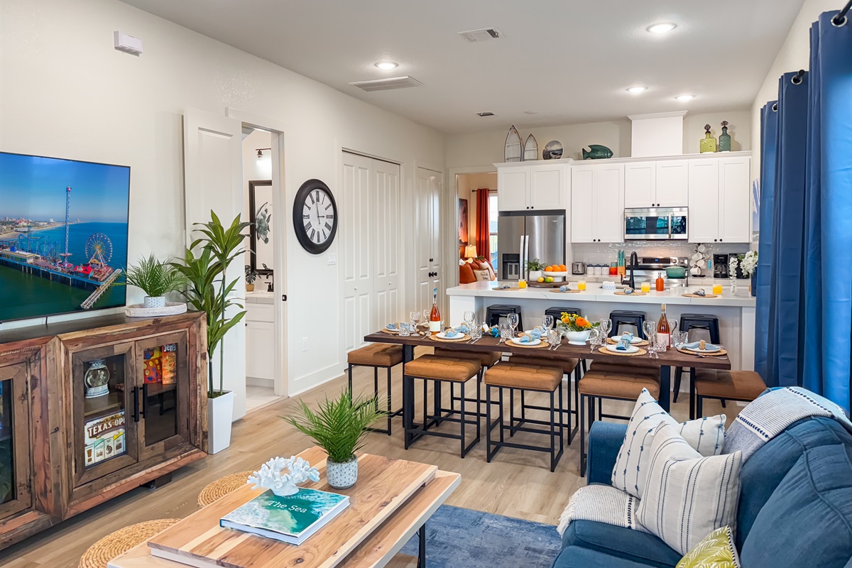 The open living room continues onto the dining area.
