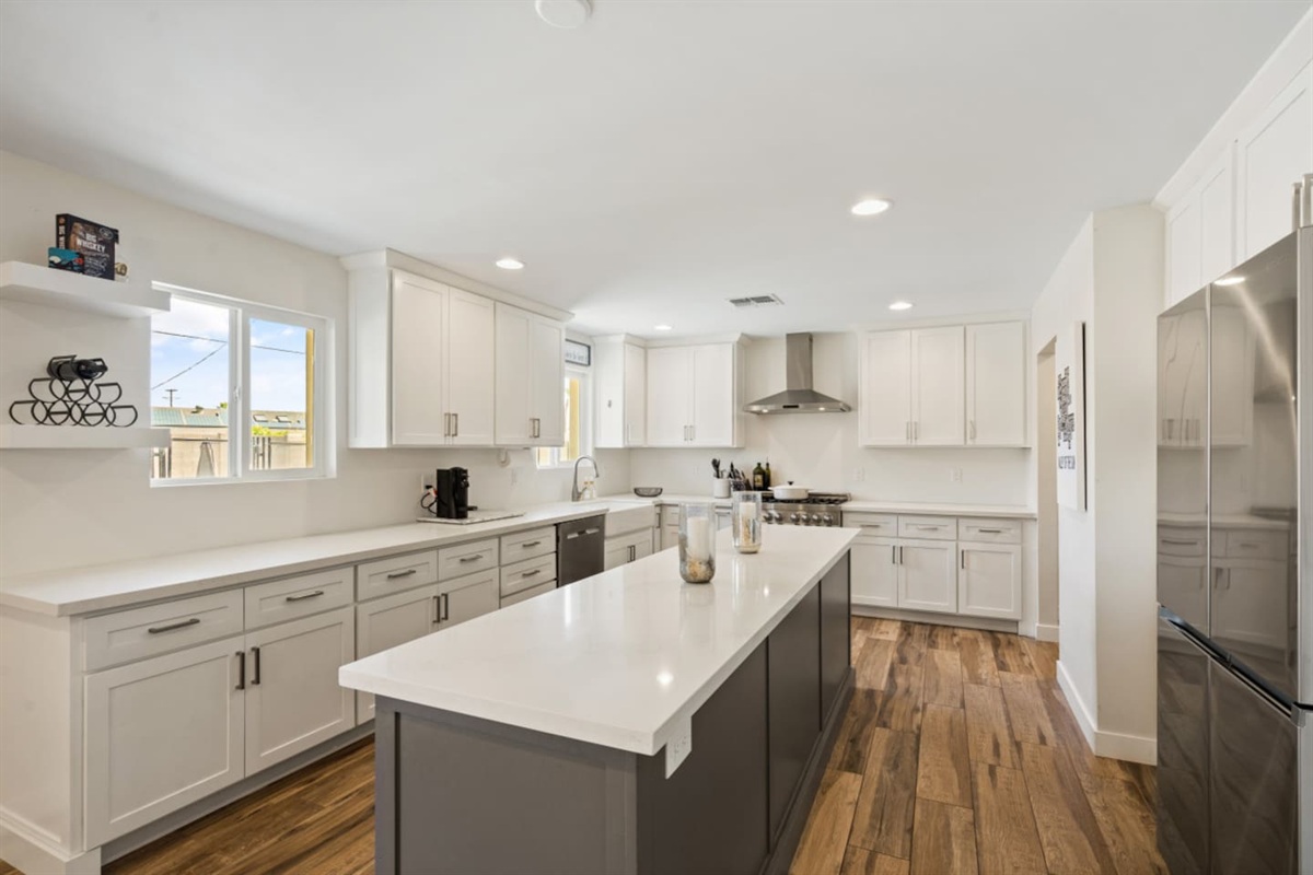 Full kitchen with large island, plenty of storage, and easy access to the dining and living areas.