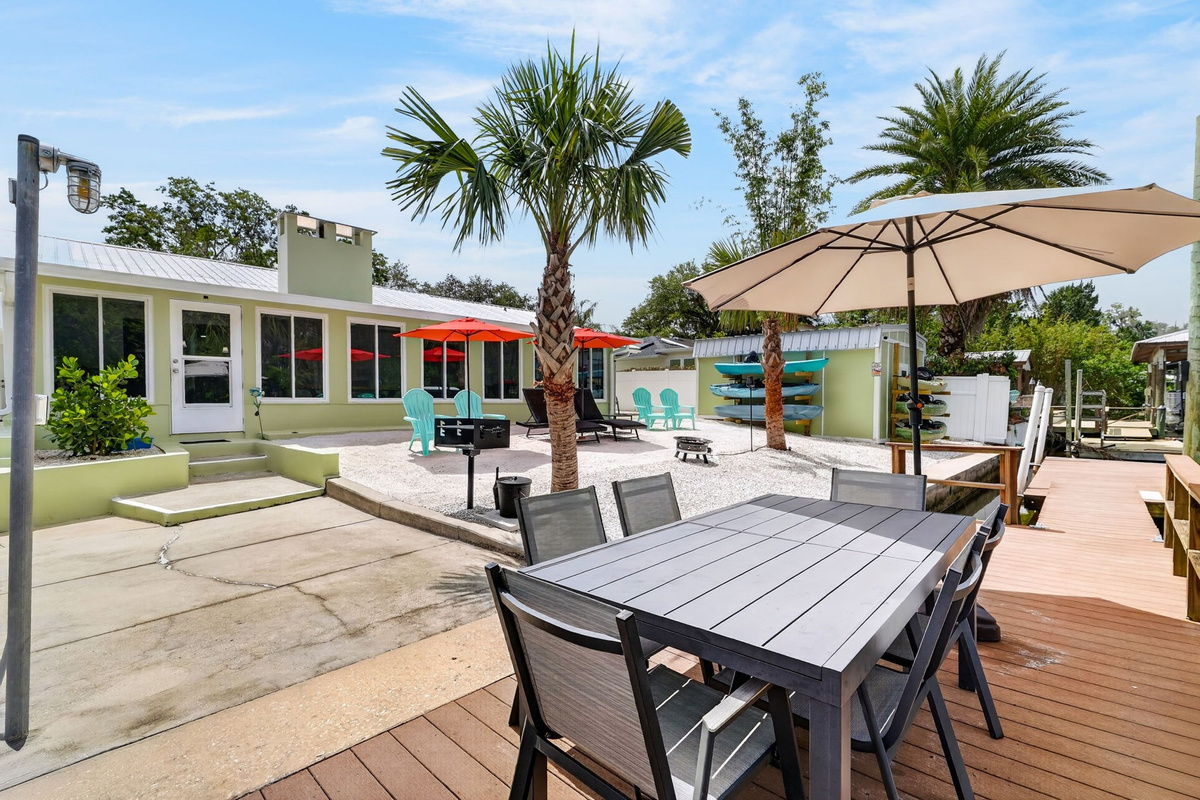 Patio dining table with umbrella on dock