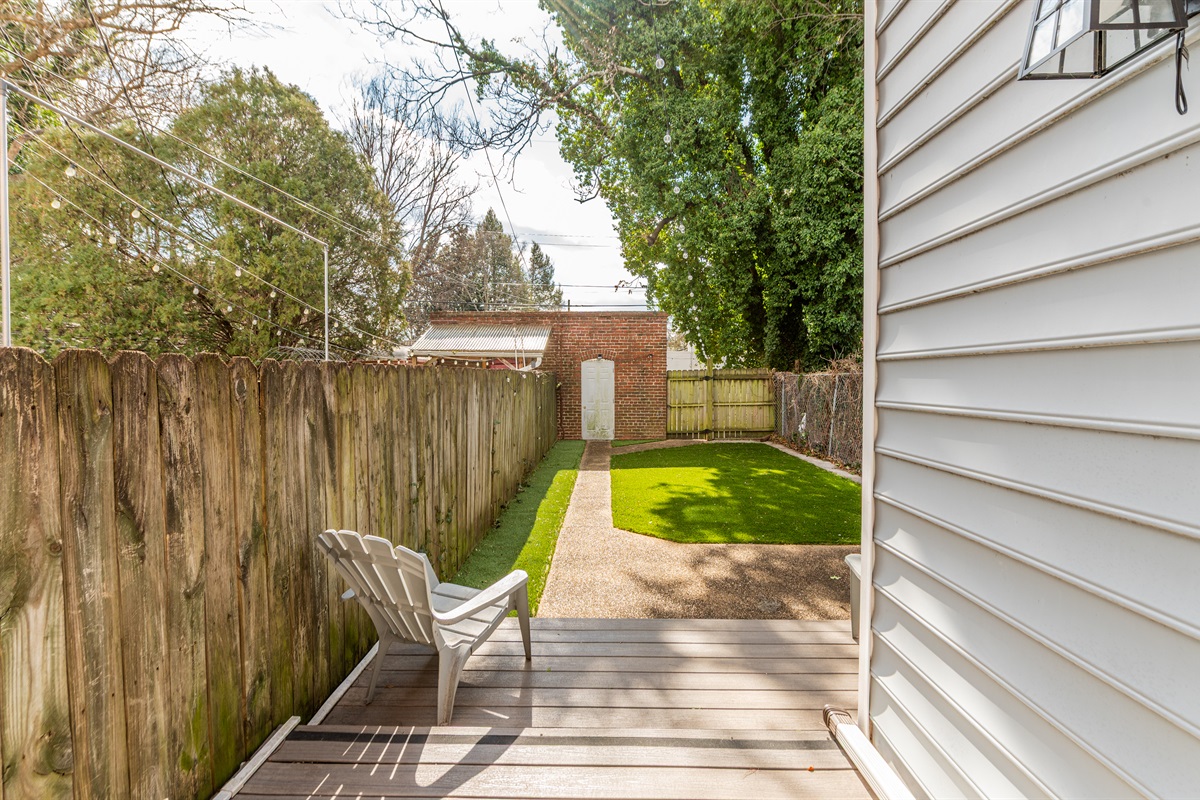 Outdoor Retreat: Enjoy peaceful moments on your private patio with lush lawn and charming views!