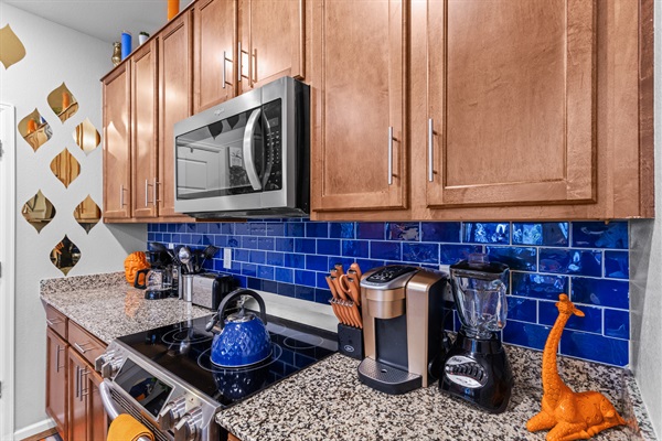 A fully-equipped kitchen with modern appliances and ample counter space, perfect for cooking and hosting