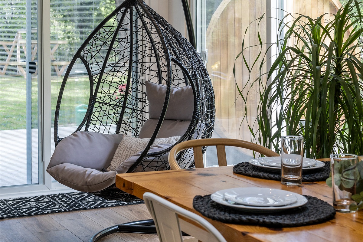 Swing, relax, and soak in the tranquility of lakeside living.