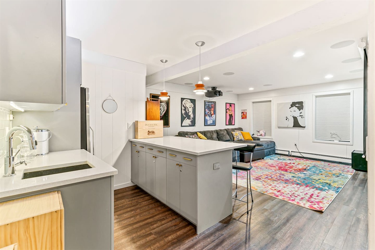 The full bar is conveniently connected to the home theater and in close proximity to the bathroom, game room, and bedroom 4, offering easy access and entertainment options for guests.
