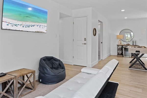 Open Living Room with Foosball, Smart TV & Coastal Decor