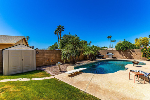 Enjoy an amazing backyard private pool with diving board and inflatable hot tub