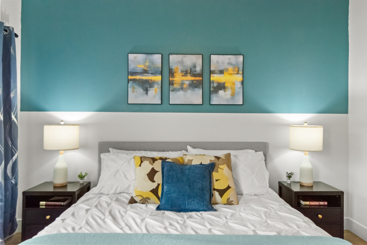 Well-lit bedroom offering a warm and welcoming environment.