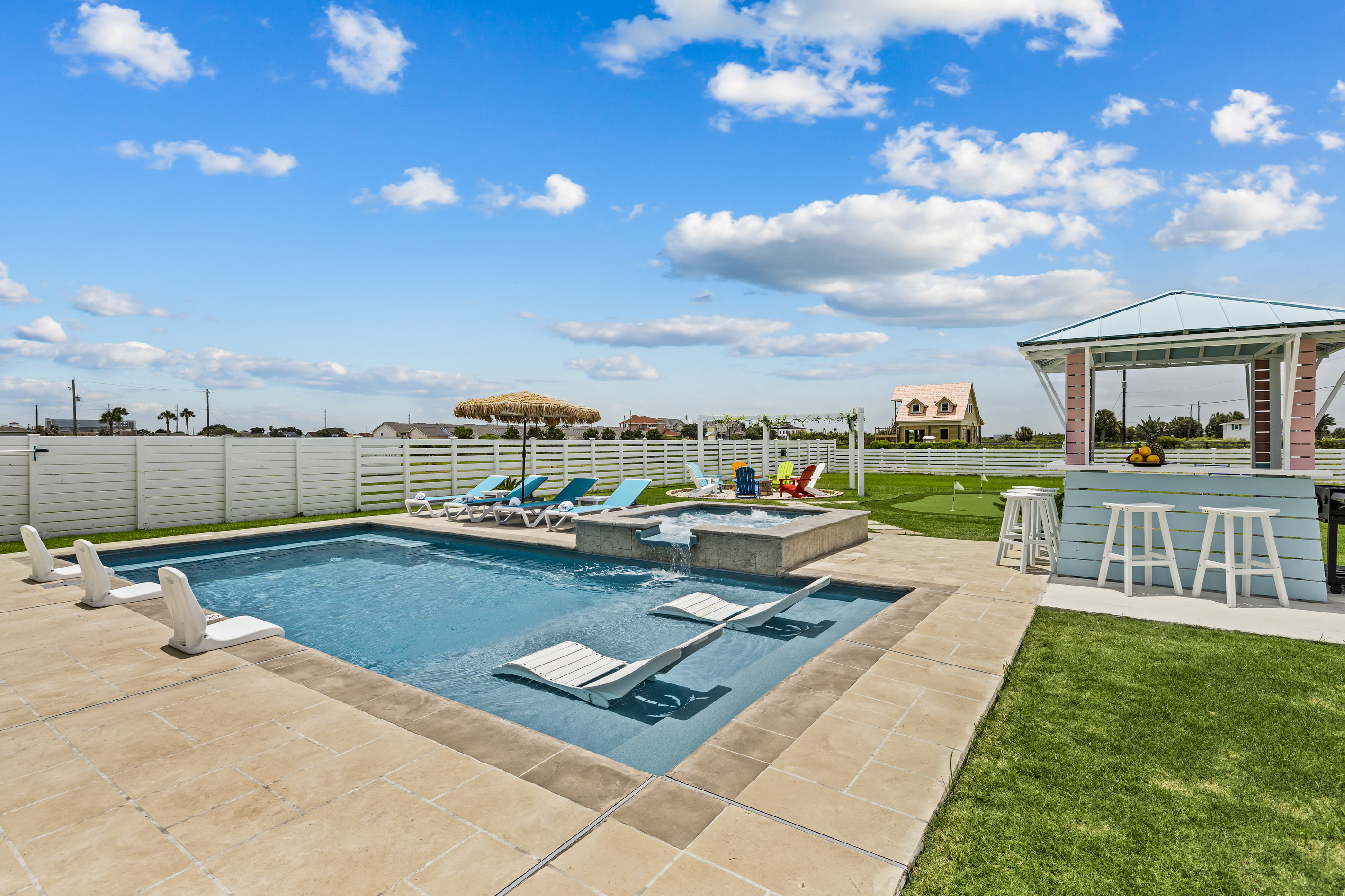 Escape to your own resort-style backyard featuring a sparkling pool, heated spa, and comfortable lounge seating—the perfect place to relax, recharge, and enjoy quality time together.