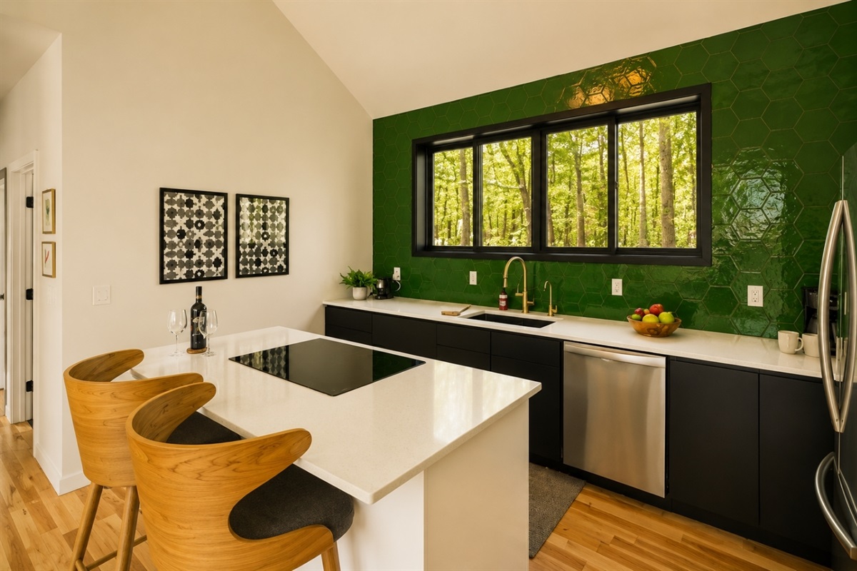 Experience a vibrant, refreshing kitchen where nature meets modern design. This stunning space features a bold green accent wall that brings a sense of calm and rejuvenation to the heart of your home. 