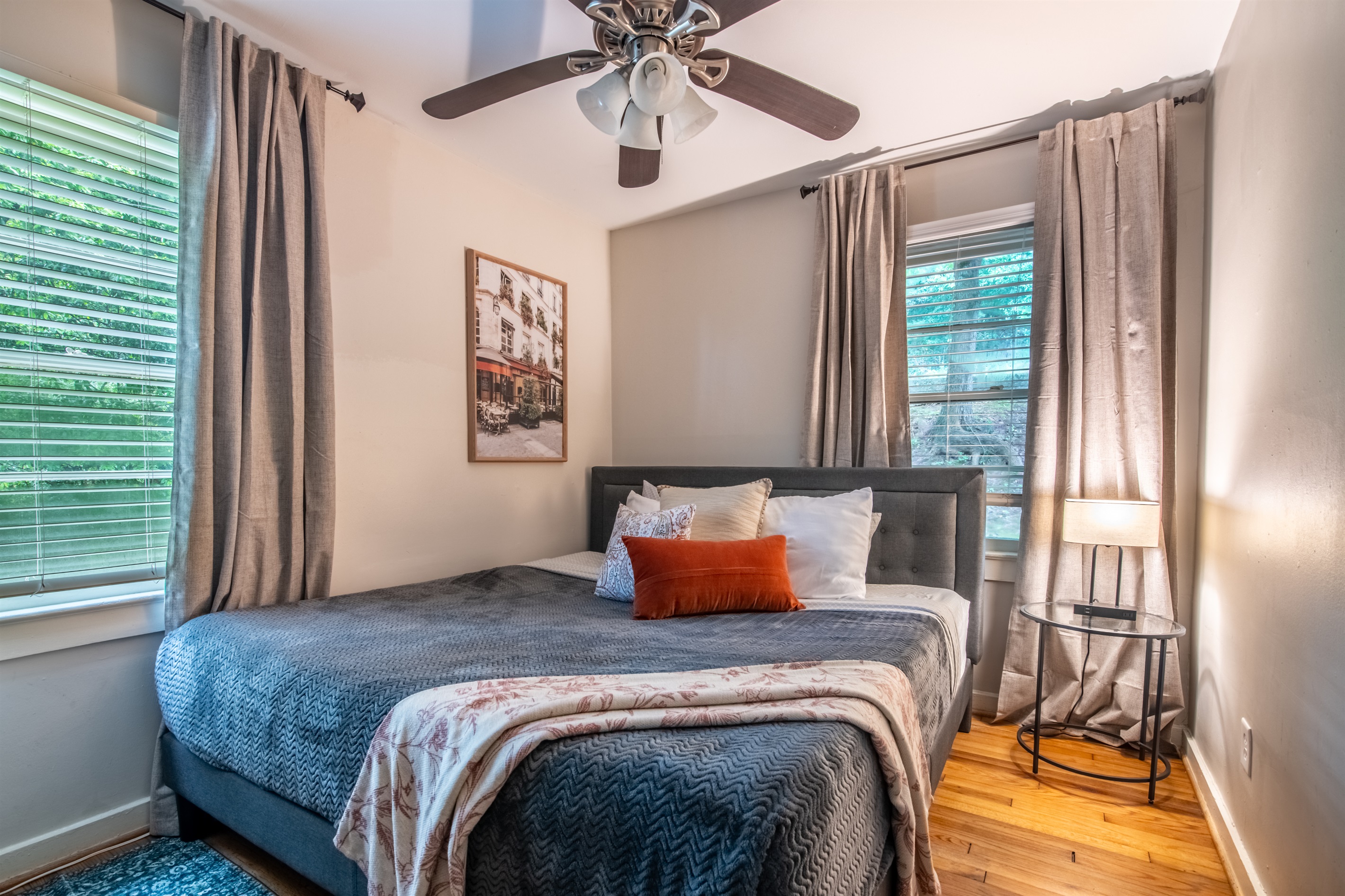 Elegant bedroom with a plush bed, soft lighting, and cozy decor touches.