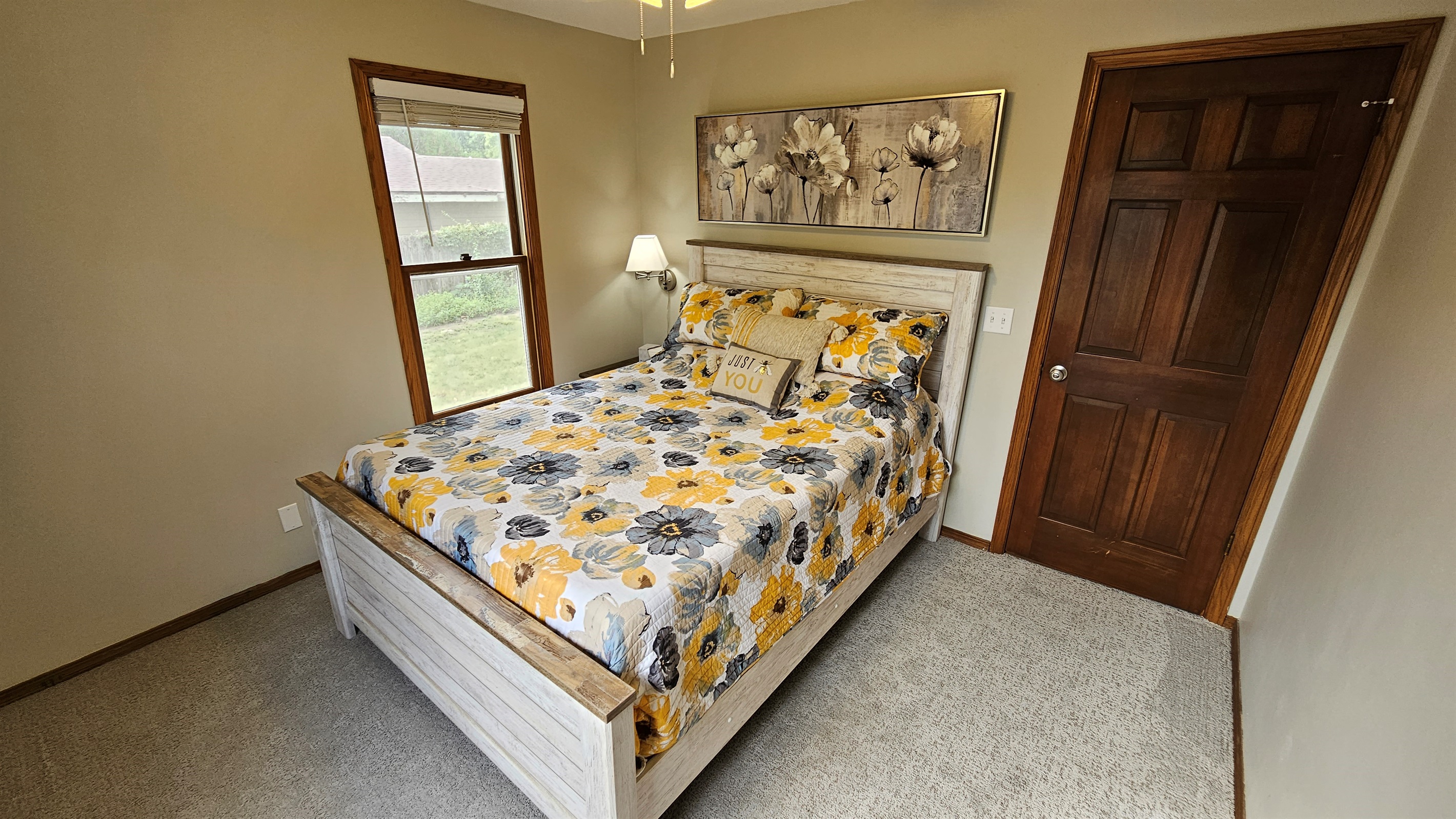 Queen sized bed in 2nd Bedroom features Purple brand mattress and pillows.