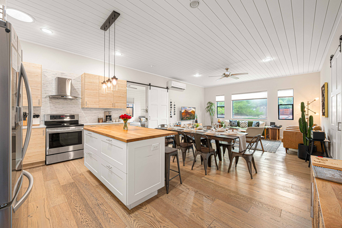 {Kitchen + Dining} The bright open-concept kitchen and dining area keeps everyone together, whether you're cooking, dining or planning the day's adventures.