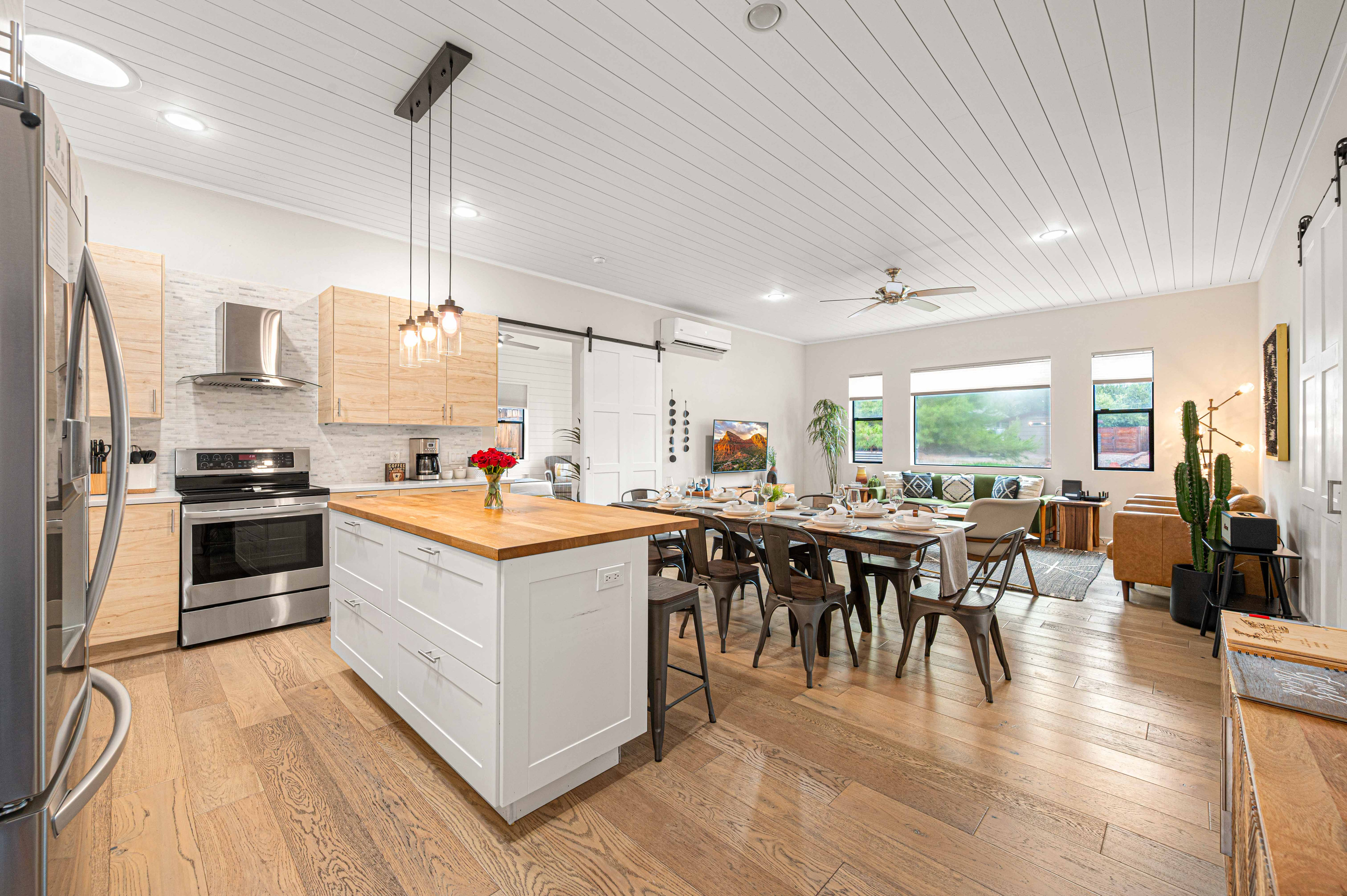 {Kitchen + Dining} The bright open-concept kitchen and dining area keeps everyone together, whether you're cooking, dining or planning the day's adventures.