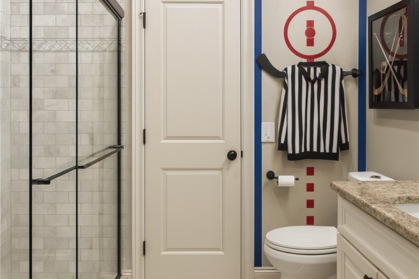Modern walk-in shower with sleek tile and glass doors