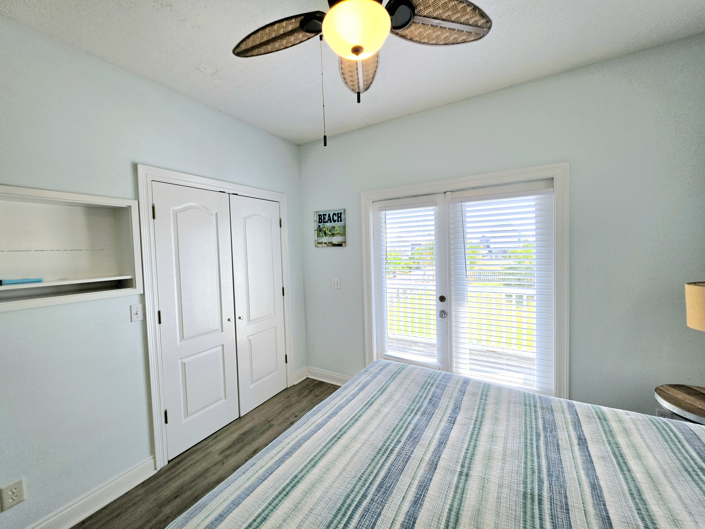 Bedroom with closet and French doors to the balcony