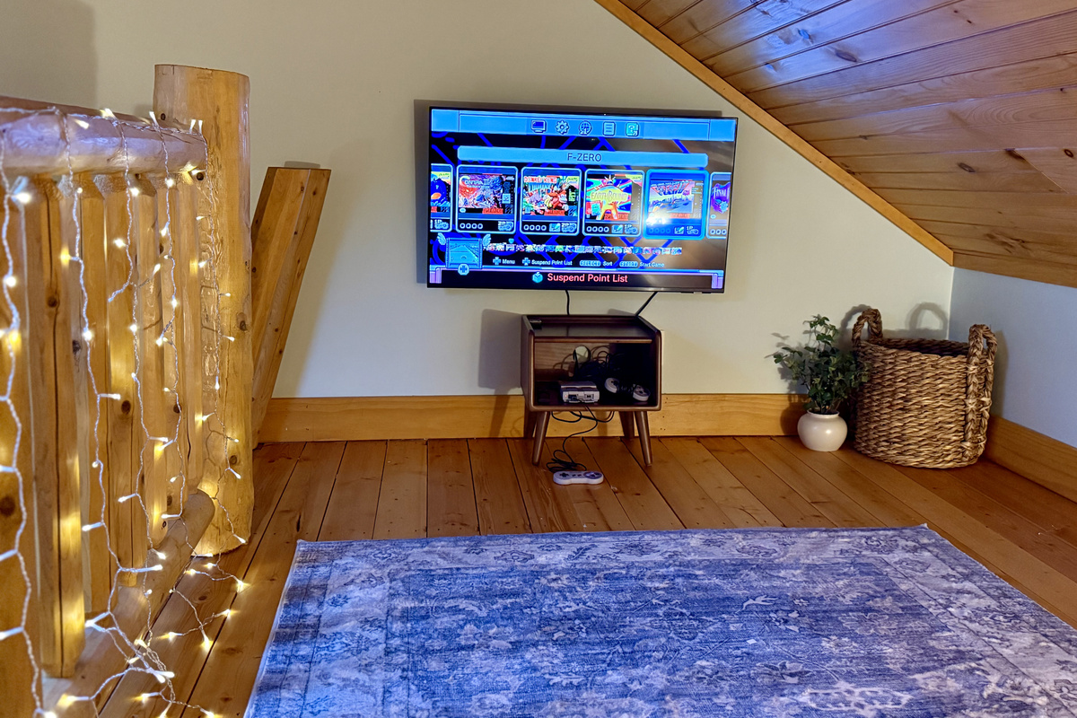 Fun loft hangout space with a retro gaming system