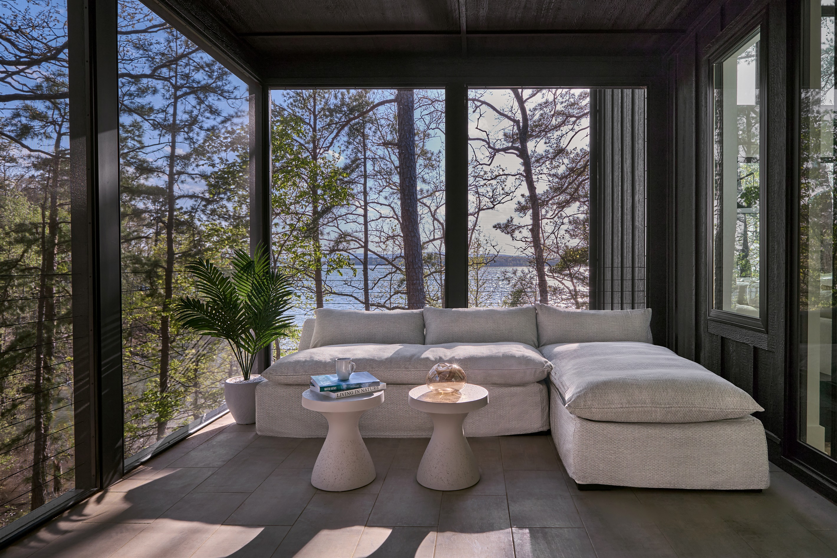 Enjoy a serene morning coffee or afternoon nap in the screened-in porch with stunning lake views.