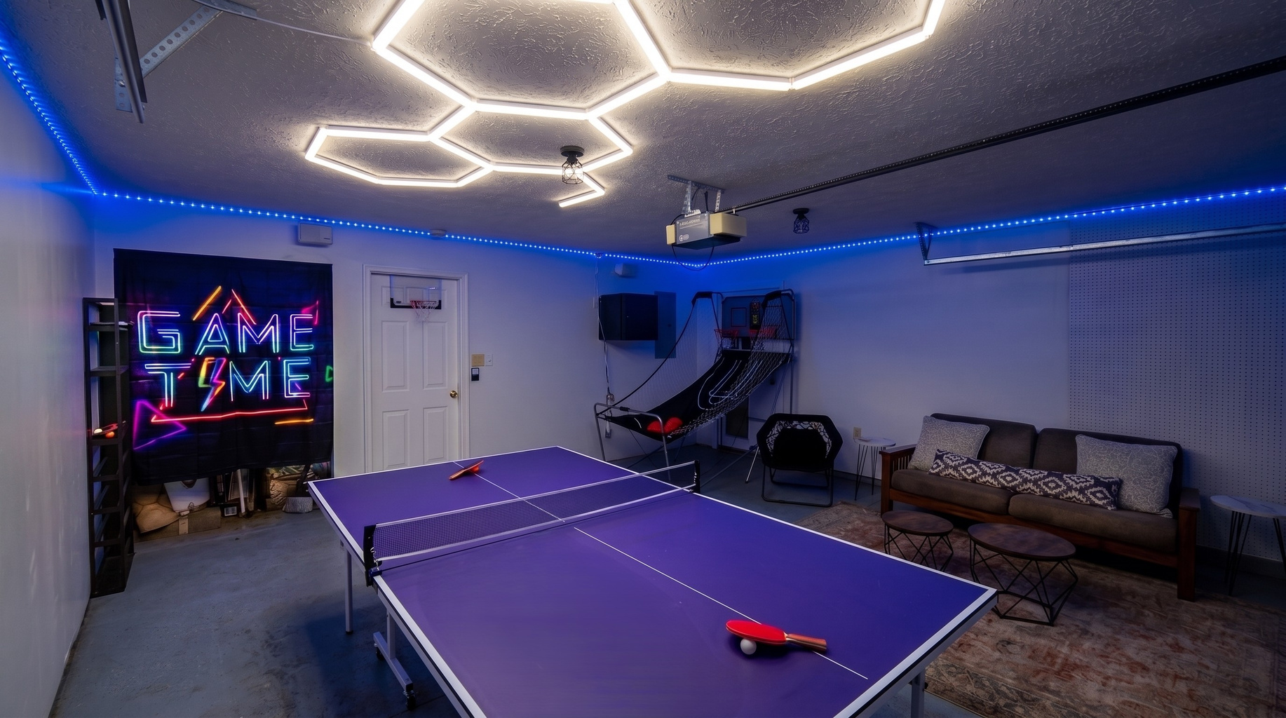The kiddos can enjoy playing ping pong and basketball in the garage.