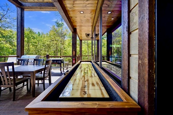 ake the fun outdoors with a friendly round of shuffleboard on the covered deck—fresh air, forest views, and a little friendly competition make the perfect combo.