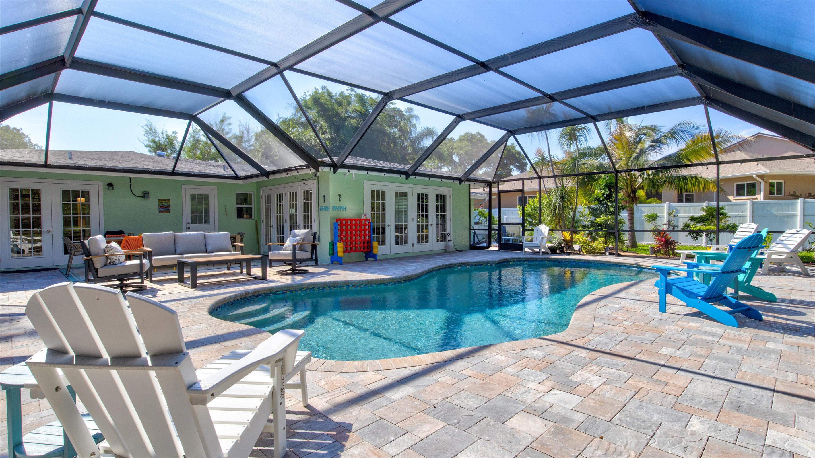 Step outside to a slice of our Robinson paradise: a sparkling pool, sun-kissed loungers, an outdoor lounge, and dining space where every moment feels like a vacation celebration.