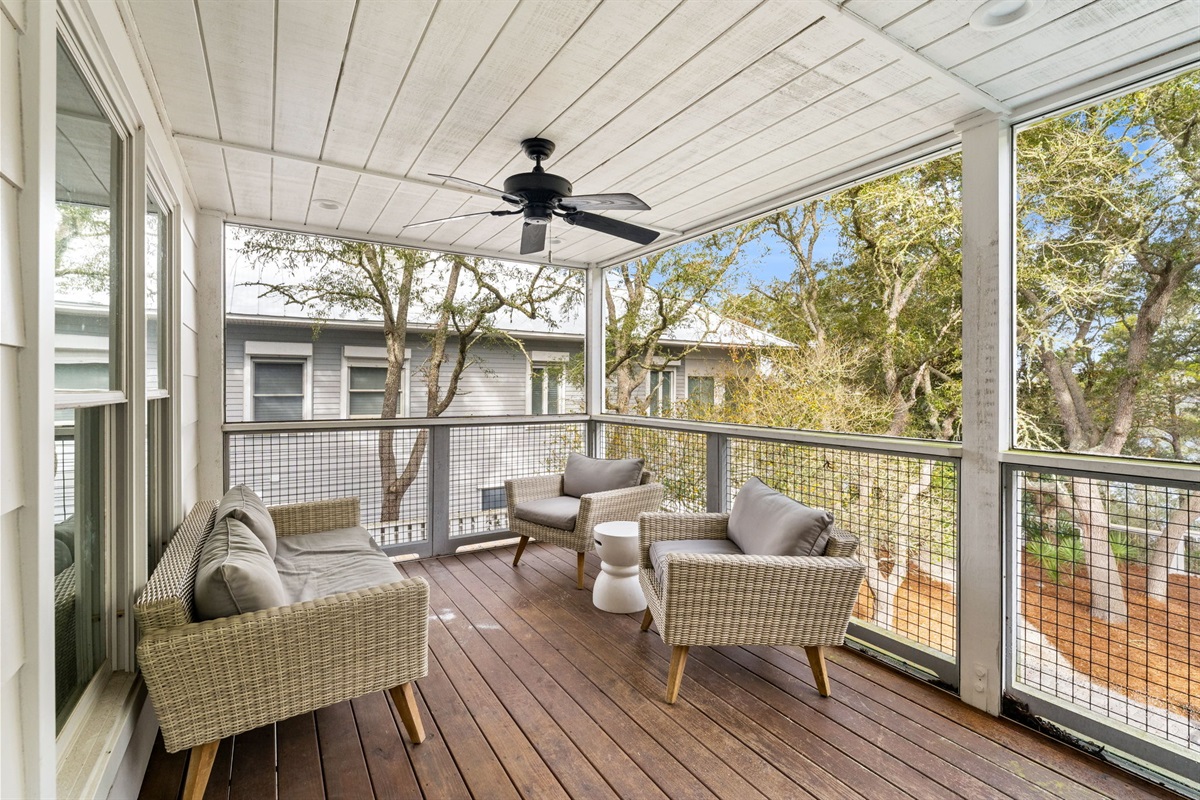 Side A: Relax on the 2nd-floor deck with cozy seating and a breezy ceiling fan.