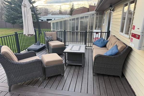 Relax on the deck overlooking the back yard