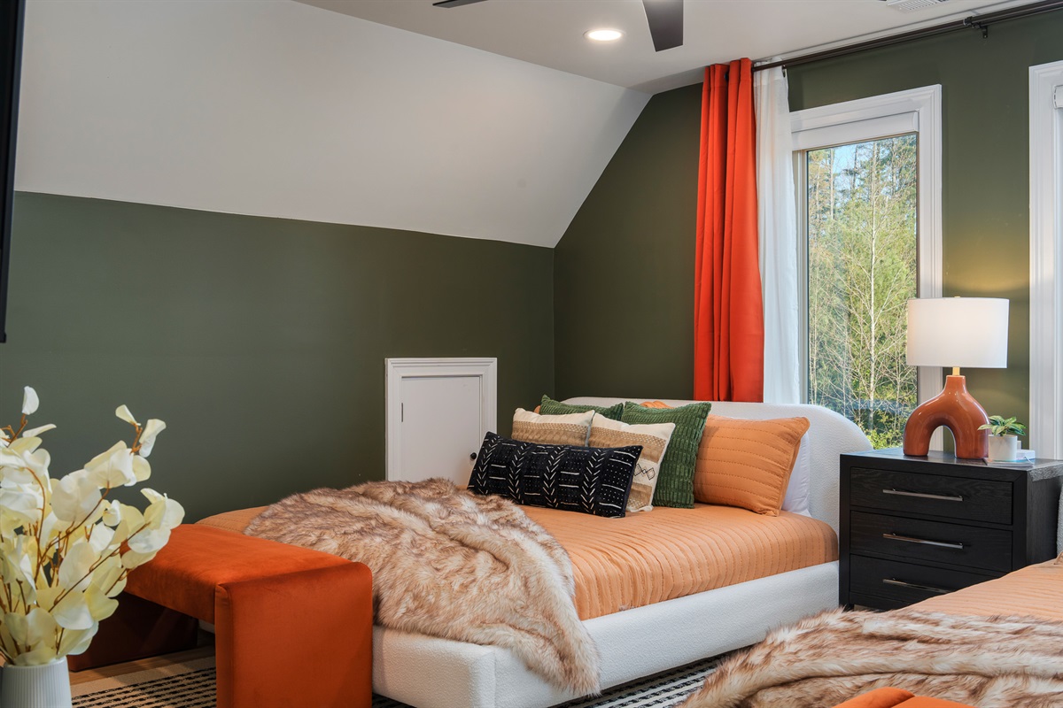 Spacious bedroom with multiple beds - ideal for groups needing flexible sleeping arrangements