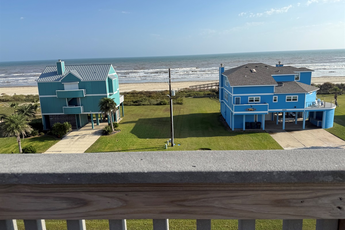 Huge views of the beach, waters, bay, and the island