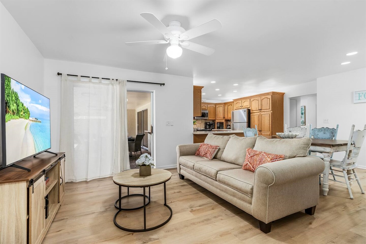 Relax in the additional living space, featuring a TV and easy access to the lanai and pool area for extended comfort and enjoyment!