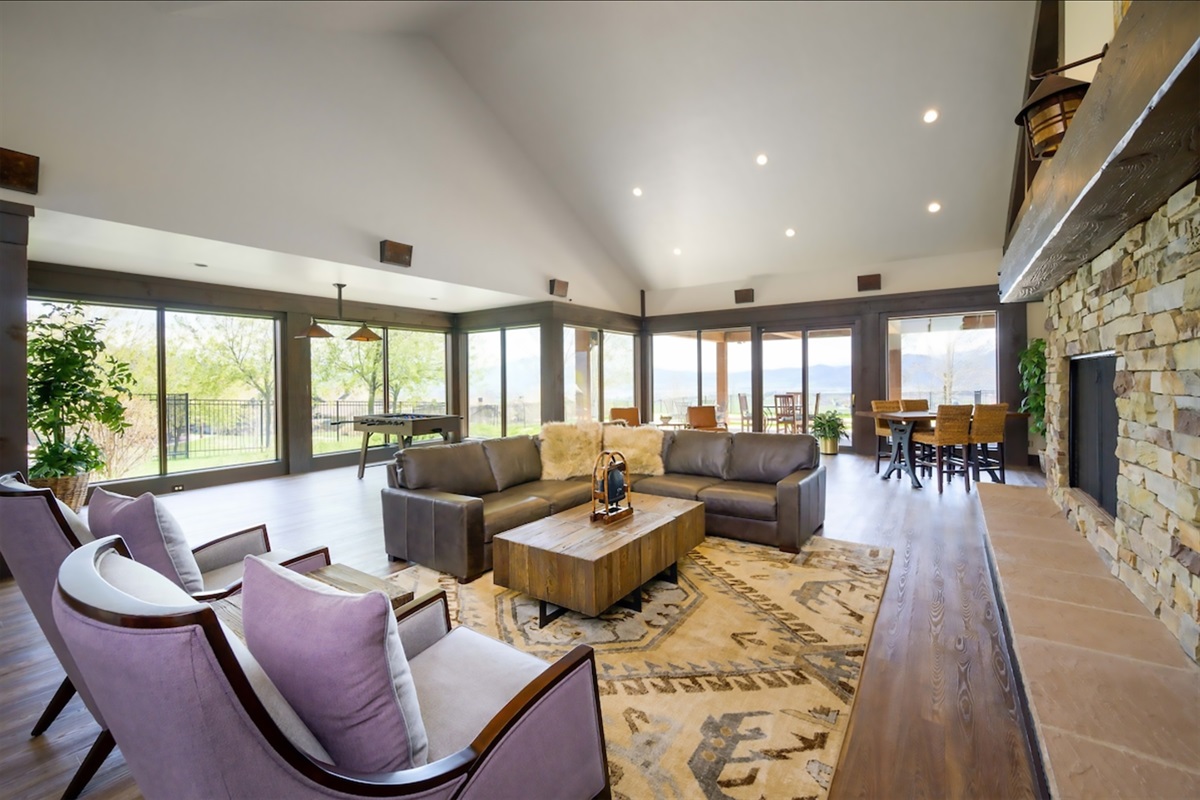 A bright and inviting community gathering space with expansive windows and plenty of room to relax or connect.