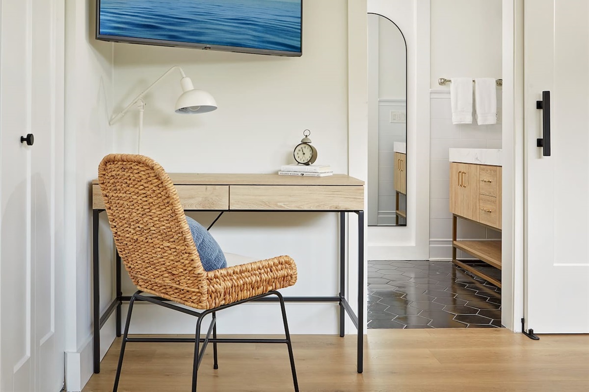 The second-floor king suite includes a spacious, dedicated workspace—perfect for working from home—with a door that can be closed for complete privacy and quiet focus.