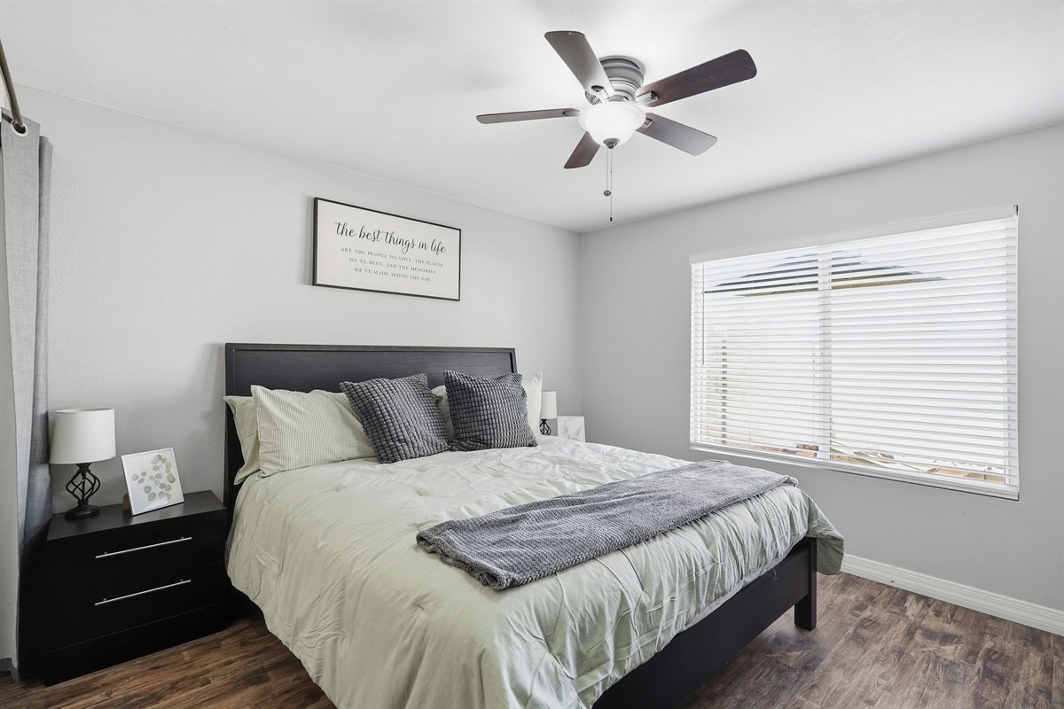 Calm, sunlit bedroom with plush bedding—your peaceful retreat for deep rest.