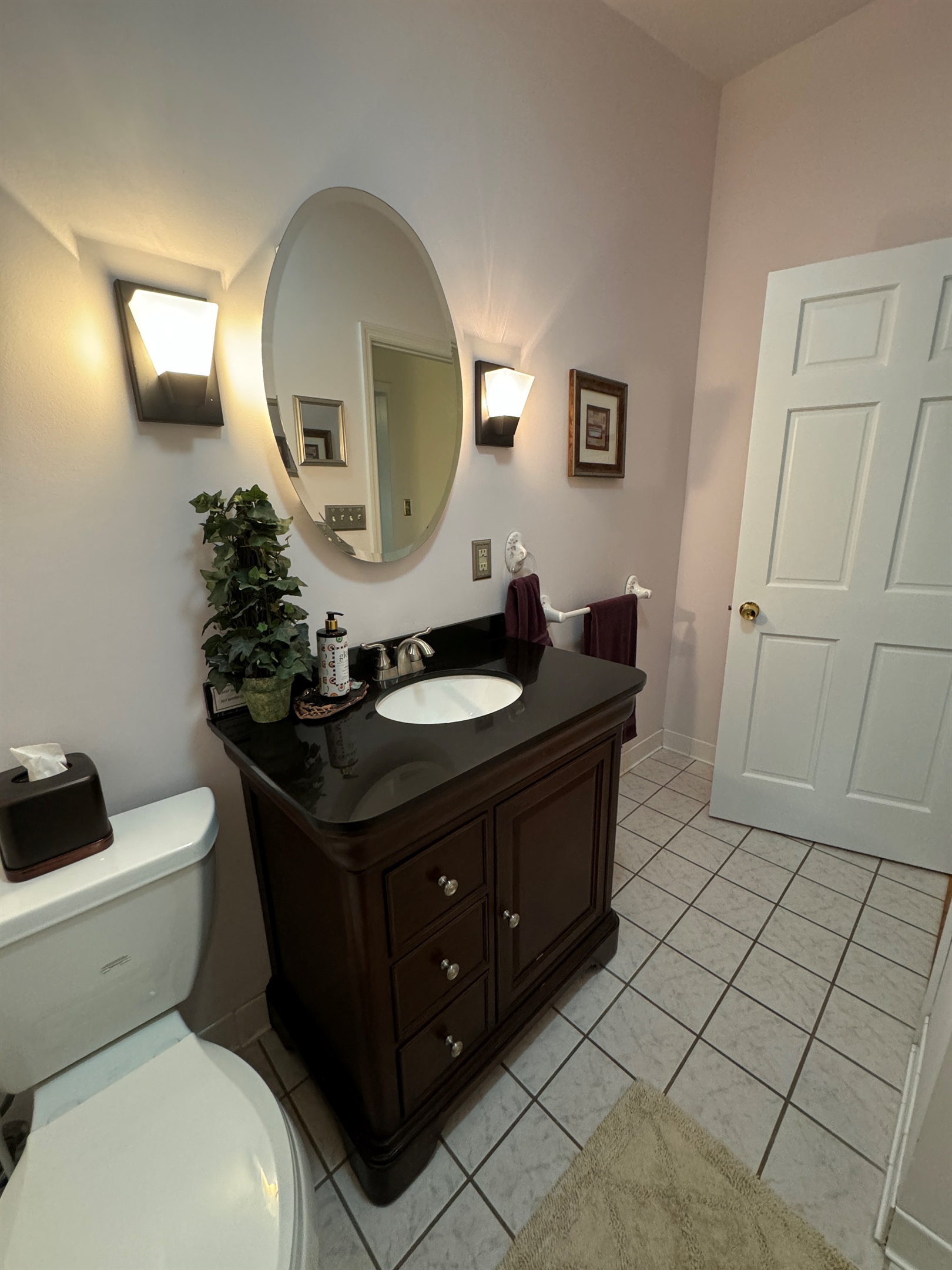 Main level bathroom off hallway.