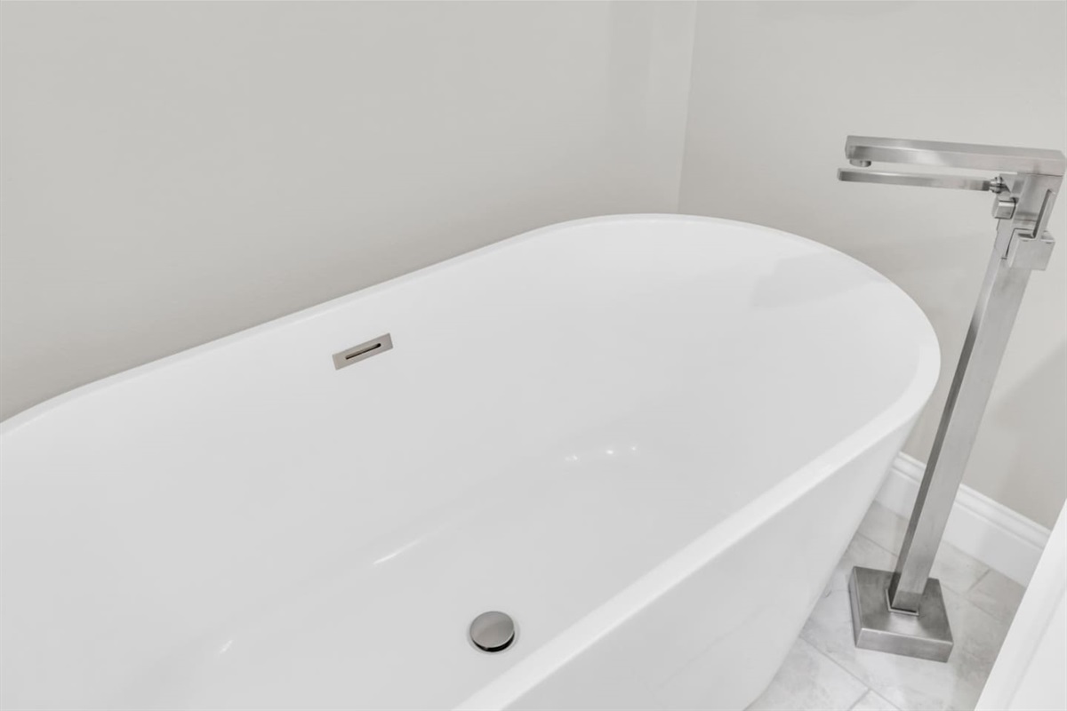 Luxurious soaking tub for ultimate relaxation.