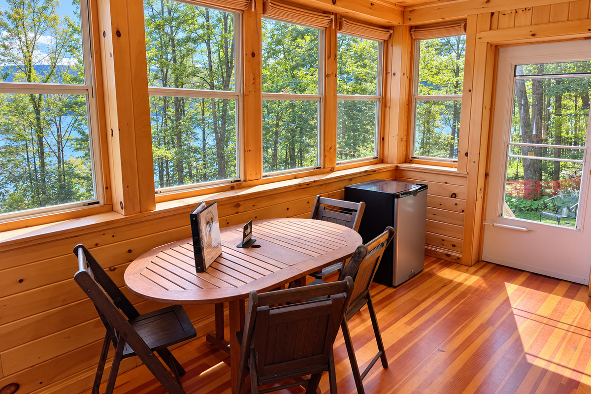Dining area on sleeping porch with mini fridge