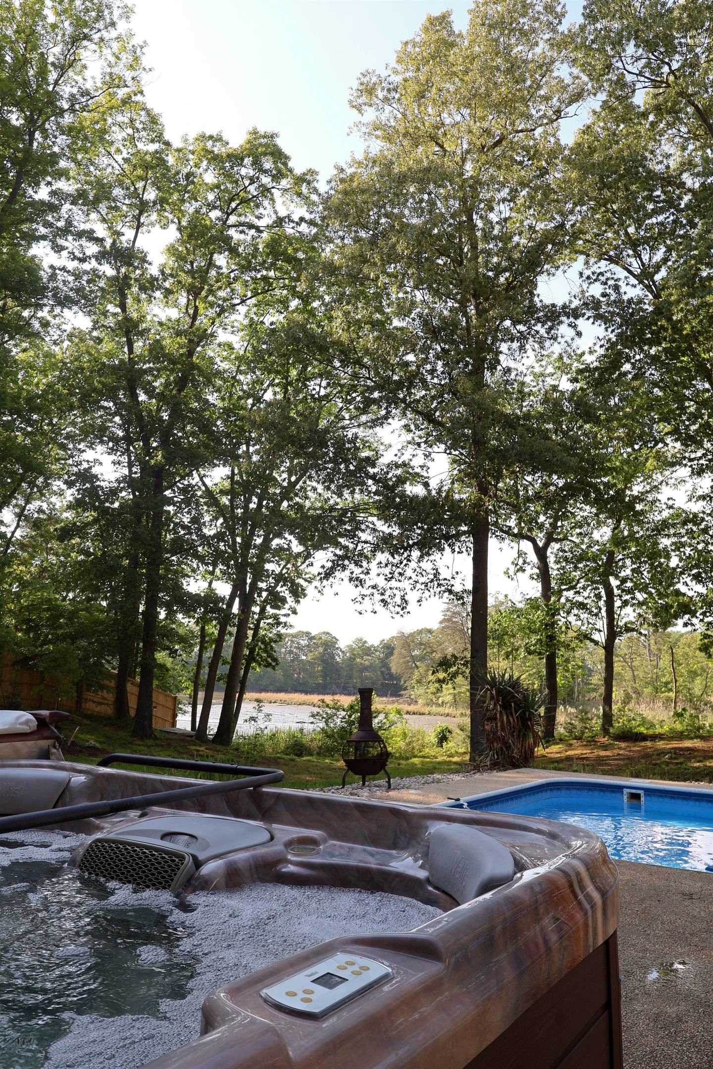 Hot tub view - looking out over the pool and on to the deep water creek