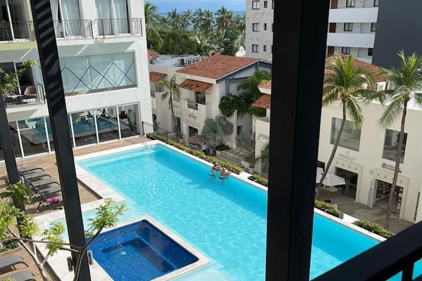 2 nd floor pool with jacuzzi and partial ocean view