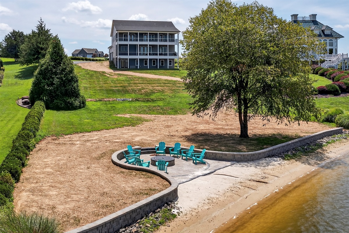 Experience Lake Anna like never before—private sandy beach, firepit under the shade of a lakeside tree, and endless water views to recharge your spirit.