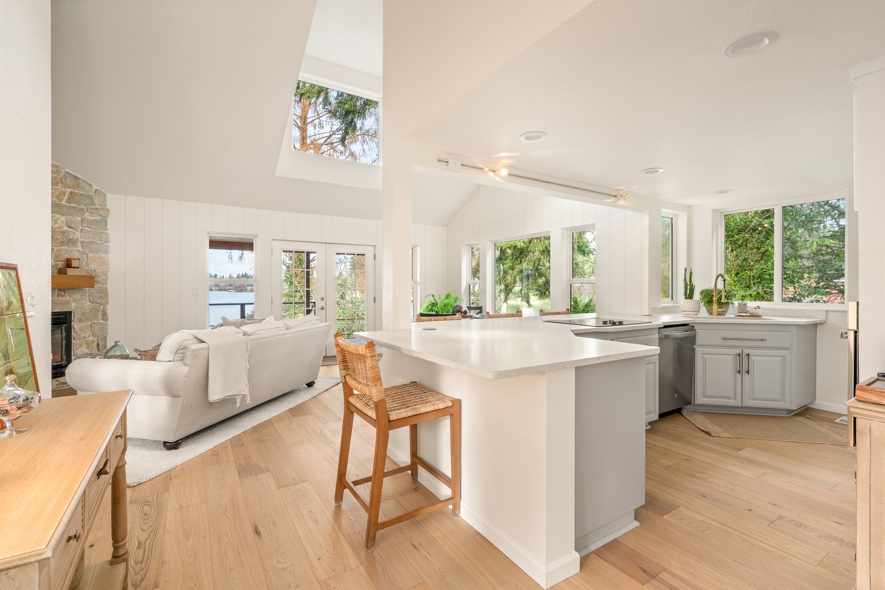 Great room lives so much more open and the views of the lake fill the room.