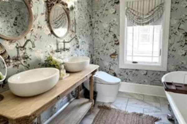 A bright bathroom setup with double sinks and a clean, relaxing feel.