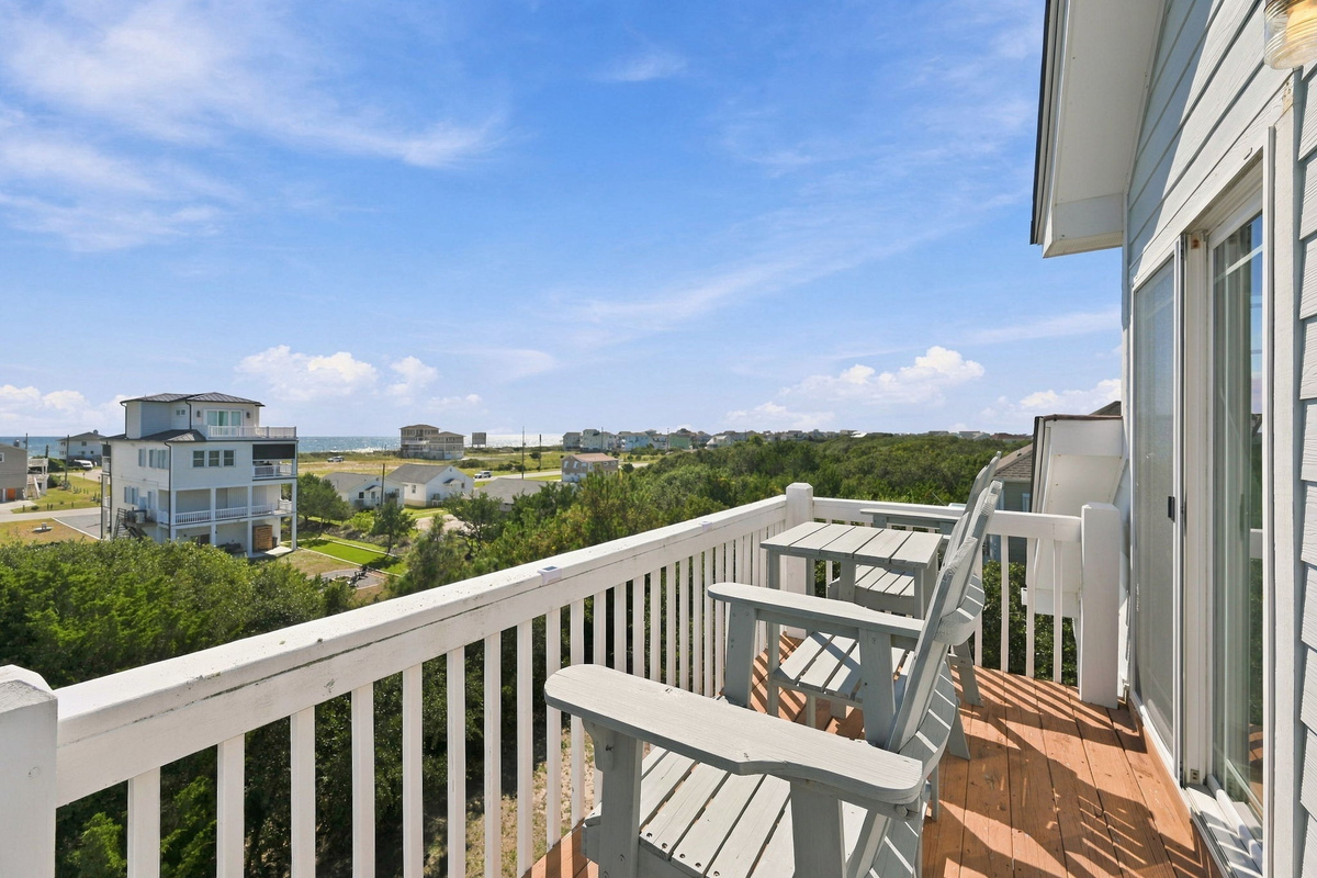 Relax and enjoy the coastal breeze from your private balcony with comfortable outdoor seating
