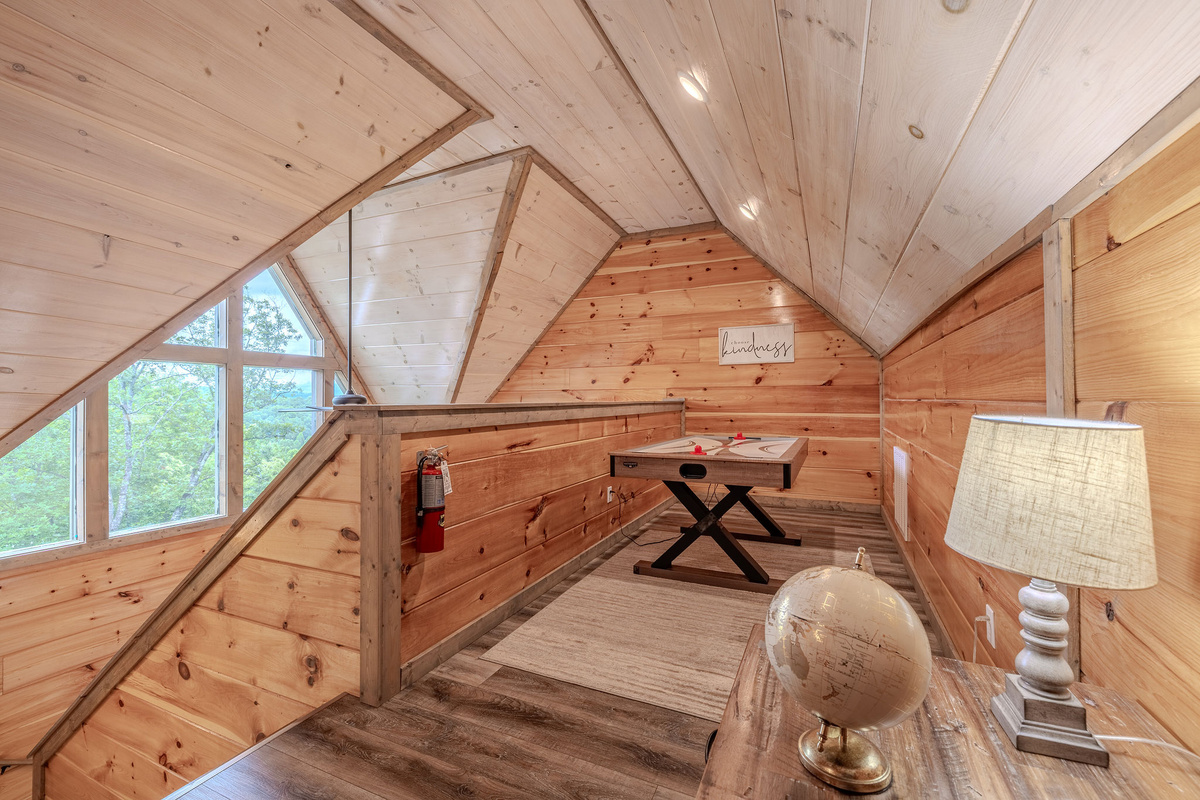 The Lookout Game Nook creates a fun upper-level hangout with air hockey and arcade entertainment.