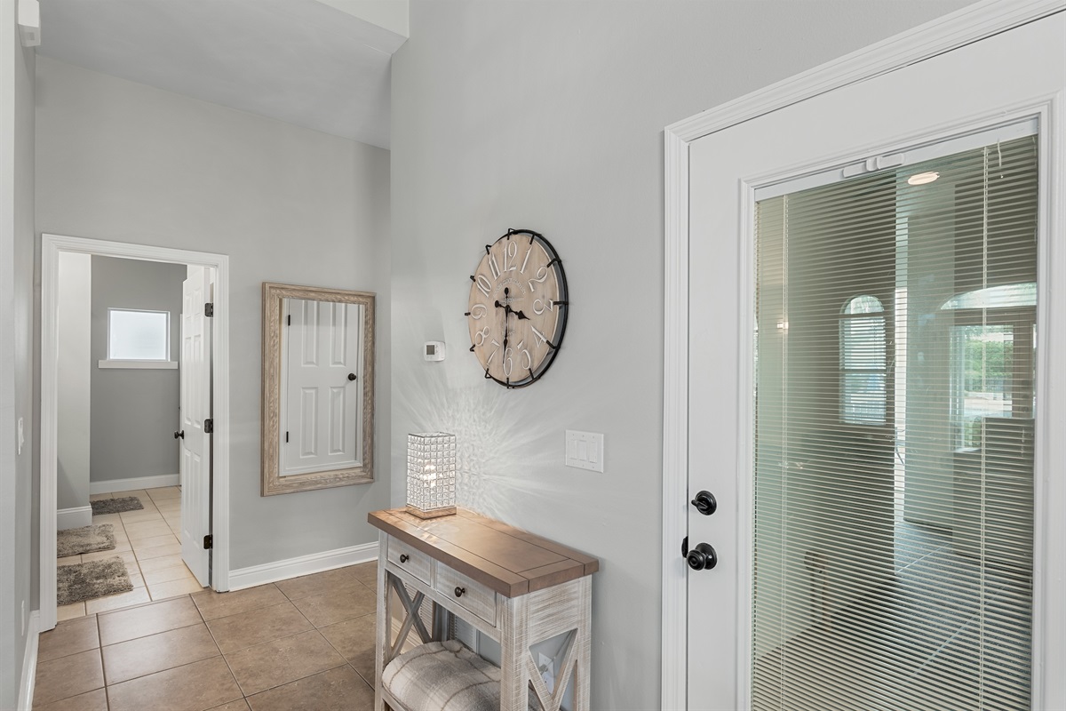 Entryway with coastal accents and convenient access to main living areas