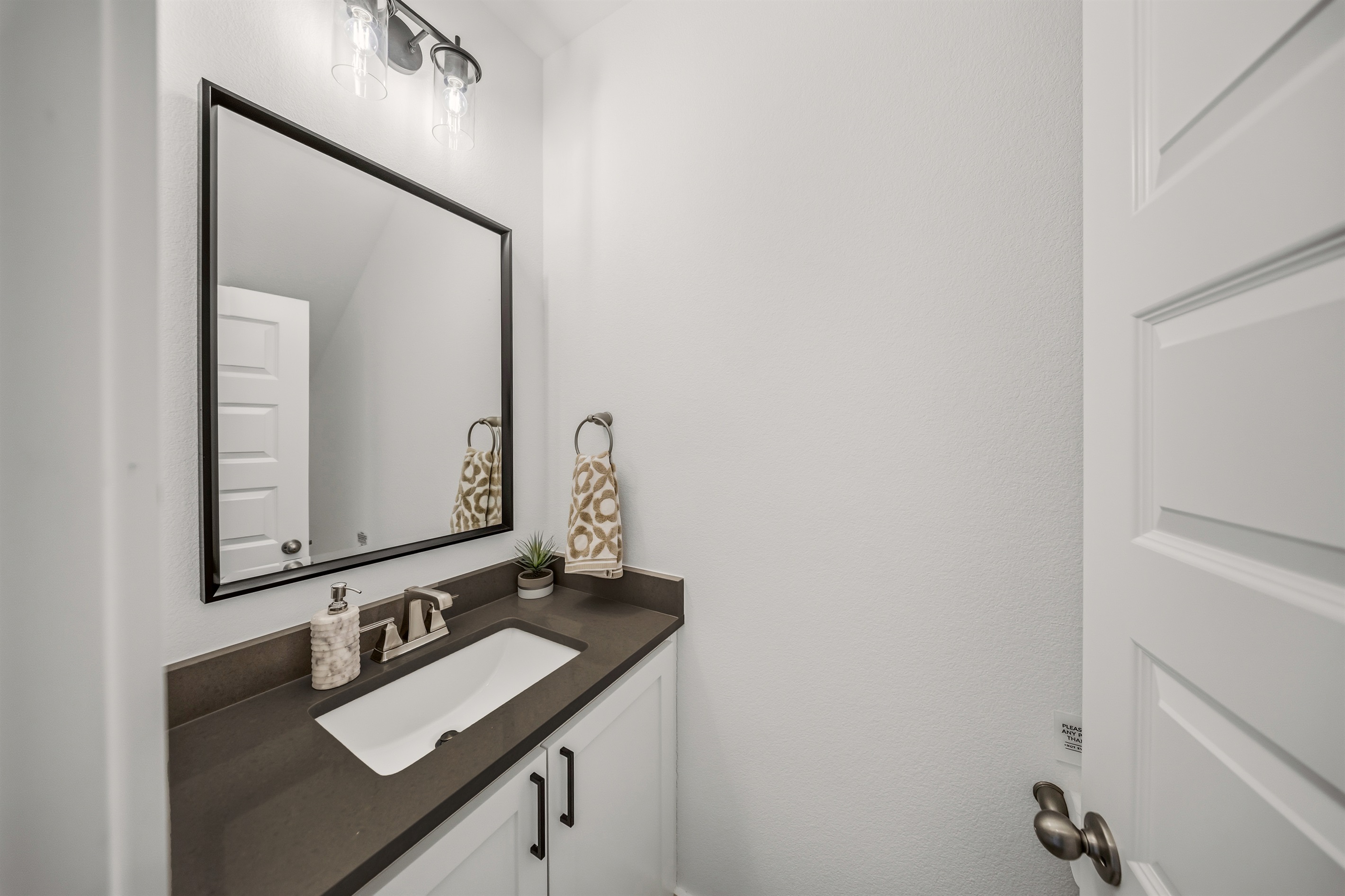 Main level half bath conveniently located off the living area