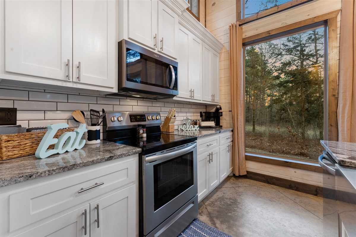 Open kitchen made for gathering where morning coffee and evening laughter flow effortlessly.
