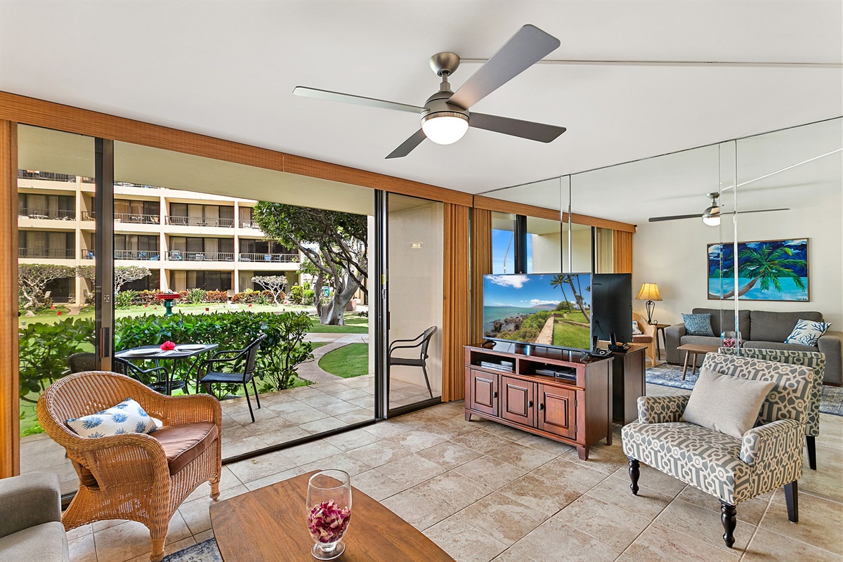 Looking towards the TV from the kitchen you have direct access to the lawn