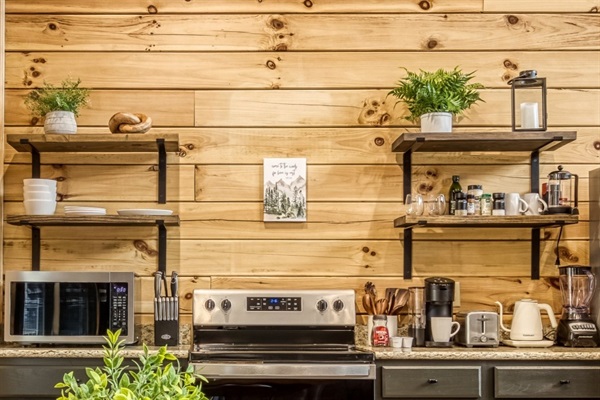 Microwave, toaster, coffee makers, hot pot, blender, sharp knives, and some spices.  Almost every cooking utensil is included in the drawers.